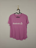 Camiseta Reebok Logo Graphic - Talla XS - Rosa Pastel - Grado A